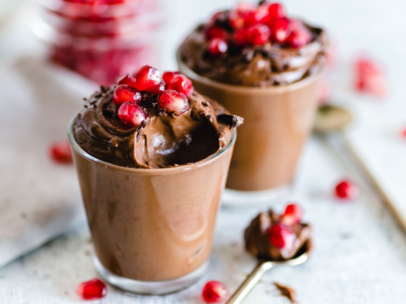 Chocolate mousse cups topped with pomegranate seeds